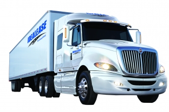 White International® heavy duty sleeper truck with Idealease on the side.